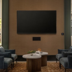 chairs around a tv and table