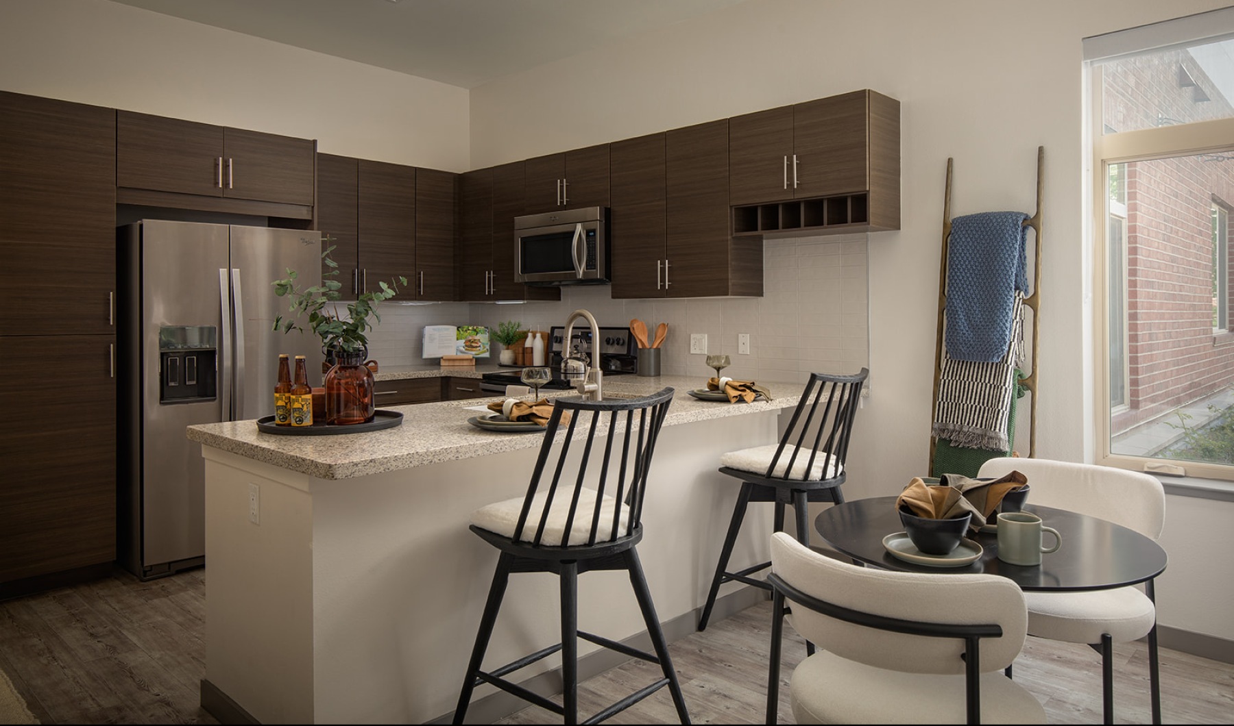 Kitchen with stainless steel appliances and kitchen island