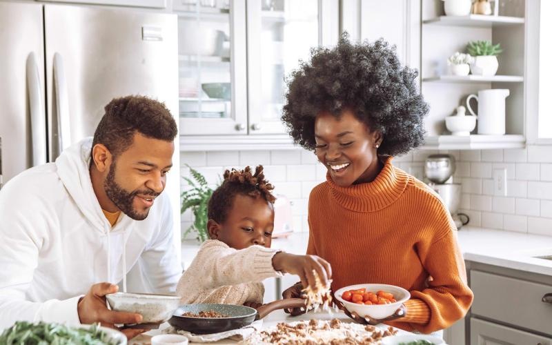 a family cooking together