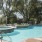 a pool with chairs around it
